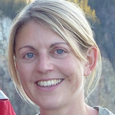 Image of a blonde woman smiling.