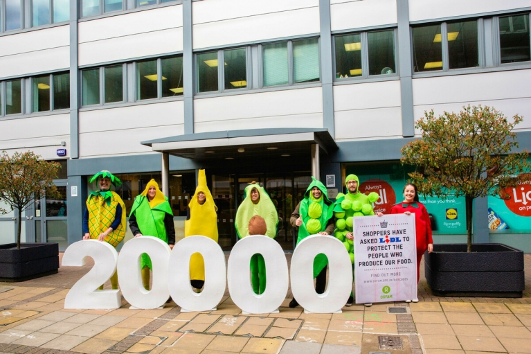In 2020, Oxfam campaigners dressed as giant fruit and veg handed in a petition with 20,000 signatures at Lidl’s London head office, urging the supermarket to do more to protect the workers behind its food (Picture: Rebecca Lonsdale/Oxfam)