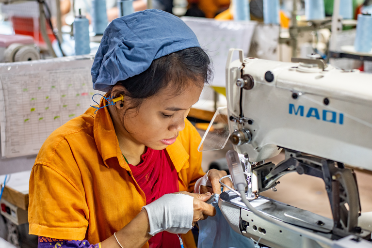 Female sewing machine operator, Chittagong, Bangladesh