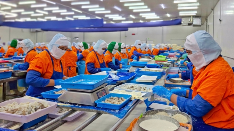 Workers processing seafood