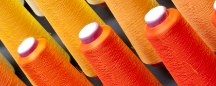 Orange cotton thread spools