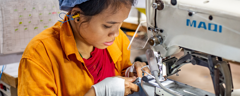 Female sewing machine operator, Chittagong, Bangladesh