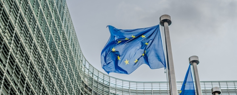 European EU flags in front of the Berlaymont building, headquarters of the European commission in Brussels. Photo credit: Shutterstock. 