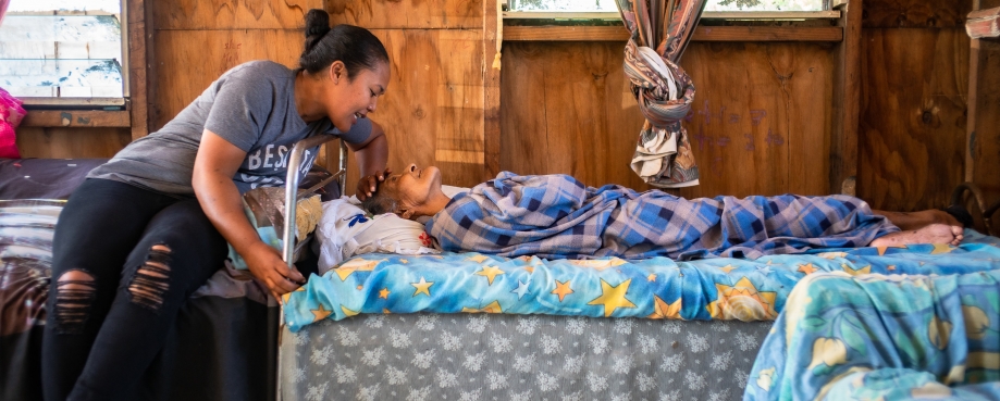 Puatiasia Faitai, caregiver, talking to the elderly, Matelita Fataua. Photo credit: Asian Development Bank/ Flick.
