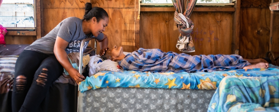 Puatiasia Faitai, caregiver, talking to the elderly, Matelita Fataua. Photo credit: Asian Development Bank/ Flick. 