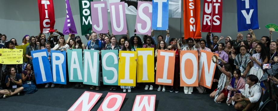 BAM activists hold up a sign calling for Just Transition. Photo by IISD/ENB | Mike Muzurakis