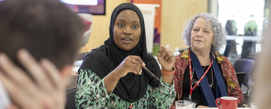 ETI staff and members engage in conversation. Photo credit: Shutterstock.