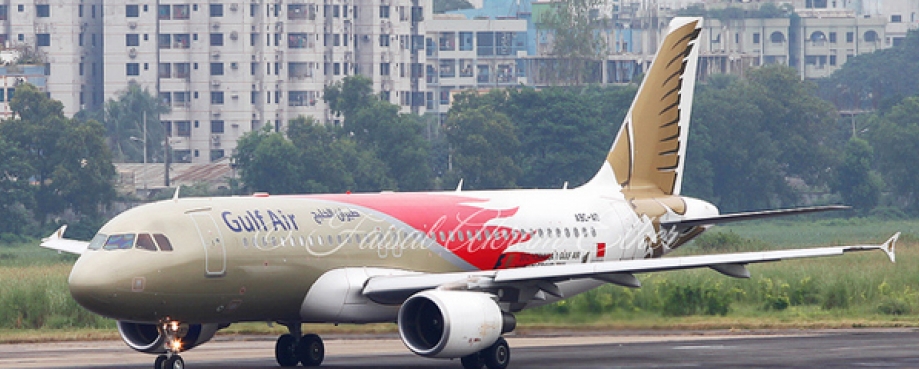Dhaka airport. Photo: https://www.flickr.com/photos/faisal_akram/ Plane on Dhaka airport runway, with high-rise buildings in background