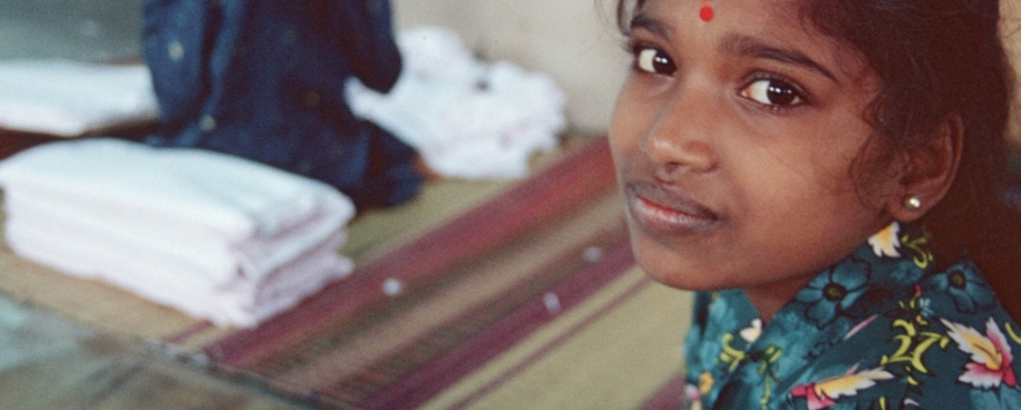 Young female garment worker, India