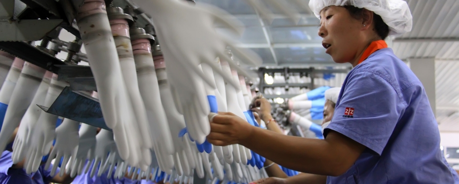 A plastic glove factory in China courtesy of Shutterstock