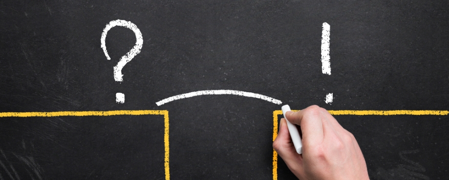 Hand sketching a bridge over the gap between problem and solution.Photo credit: Shutterstock.