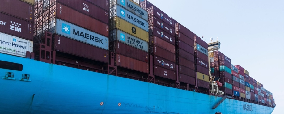 Side view on the fully loaded cargo container ship in the Red Sea, owned by the Maersk Line. Photo credit: Shutterstock.