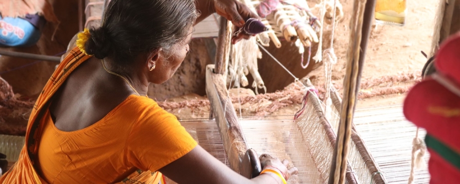 Handloom weaver in Tamil Nadu, India working in her loom. Photo credit: Shutterstock.