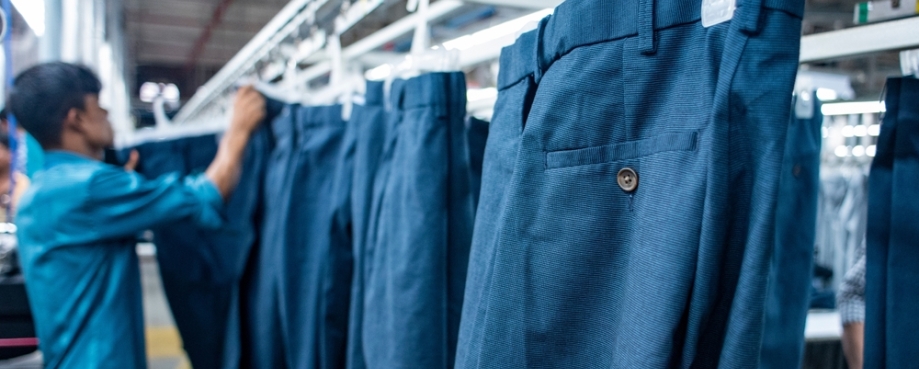 angladeshi Ready made garments workers working inside in a factory at Chittagong Export Processing Zone, Chattogram, Bangladesh. Photo credit: Shutterstock.