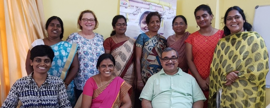 Bev Hall (top second left) and Alok Singh (seated first right) with TTCU leaders.