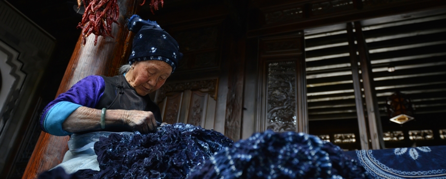 Chinese Bai ethnic minority batik worker courtesy of shutterstock