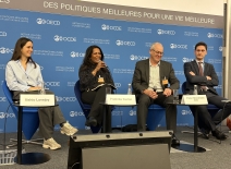 Panellist sit on stage at the OECD Forum on Due Diligence in the Garment & Footwear Sector. Photo credit: OECD.