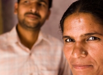 Female homeworker and her husband, behind. India.