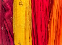 Brightly coloured, embroidered fabrics