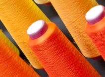 Orange cotton thread spools