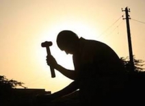 Indian stoneworker at sunset