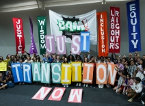 BAM activists hold up a sign calling for Just Transition. Photo by IISD/ENB | Mike Muzurakis