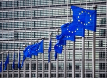 Row of EU Flags in front of the European Union Commission building in Brussels.