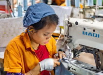 Female sewing machine operator, Chittagong, Bangladesh
