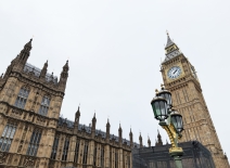 Dramatic view of Big Ben and the Gothic Houses of Parliament with an ornate street lamp in London, UK. Photo credit: Shutterstock.