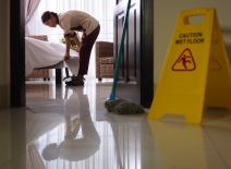 Hotel maid cleaning room